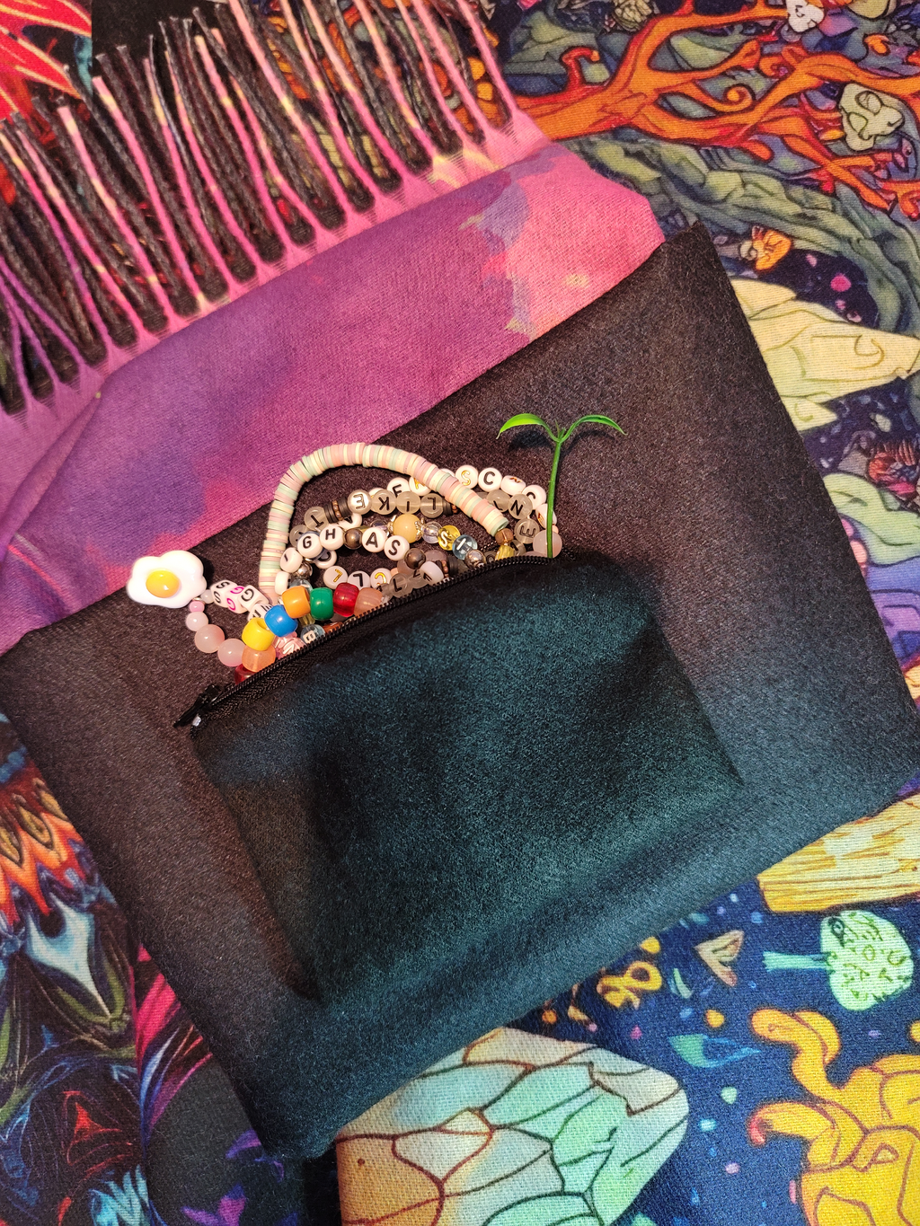 Pashmina showing hidden pocket with essential items inside like kandi and trinkets