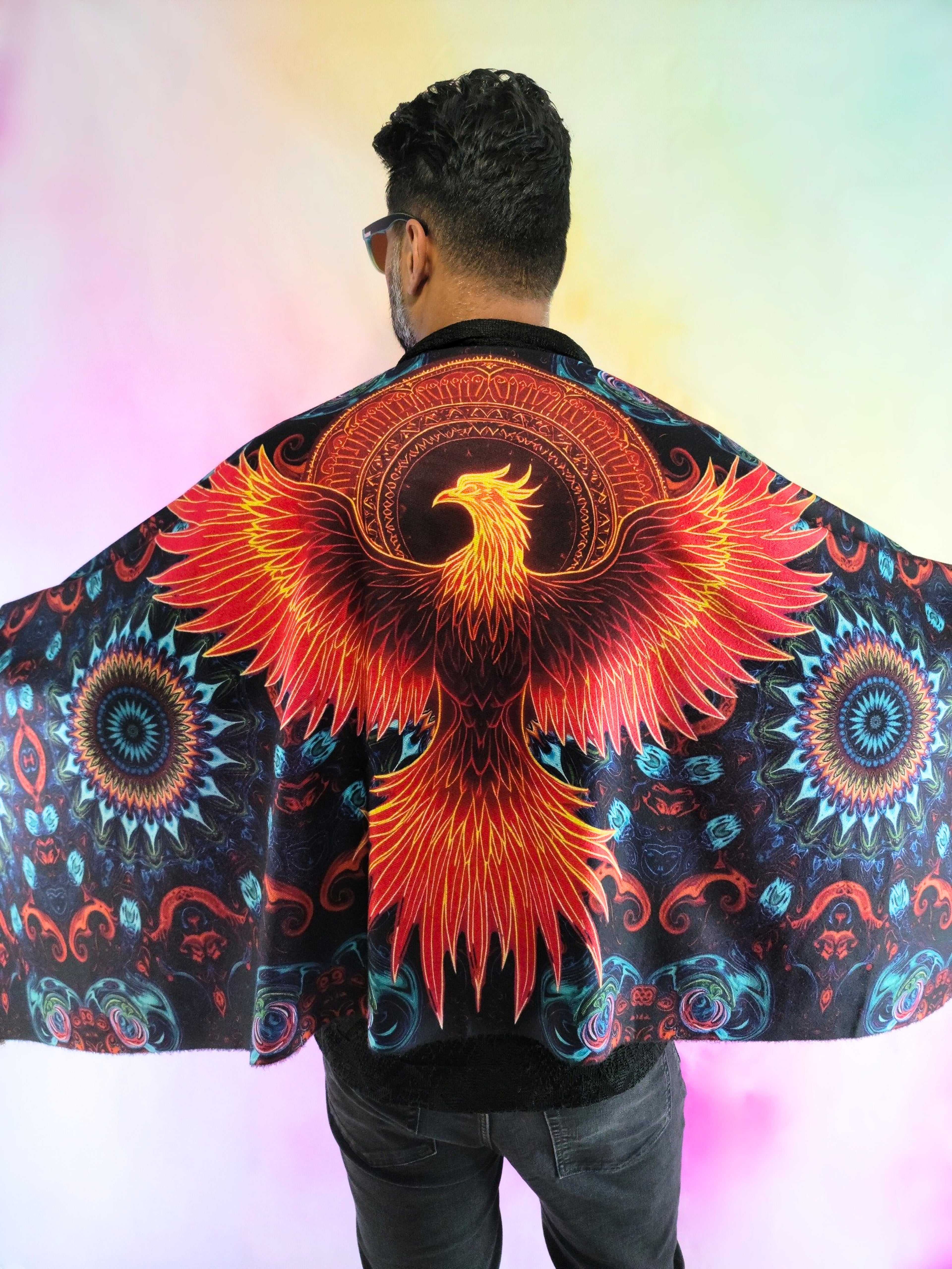 Pashmina with Phoenix Ignited design being worn on the back and arms open to show phoenix design