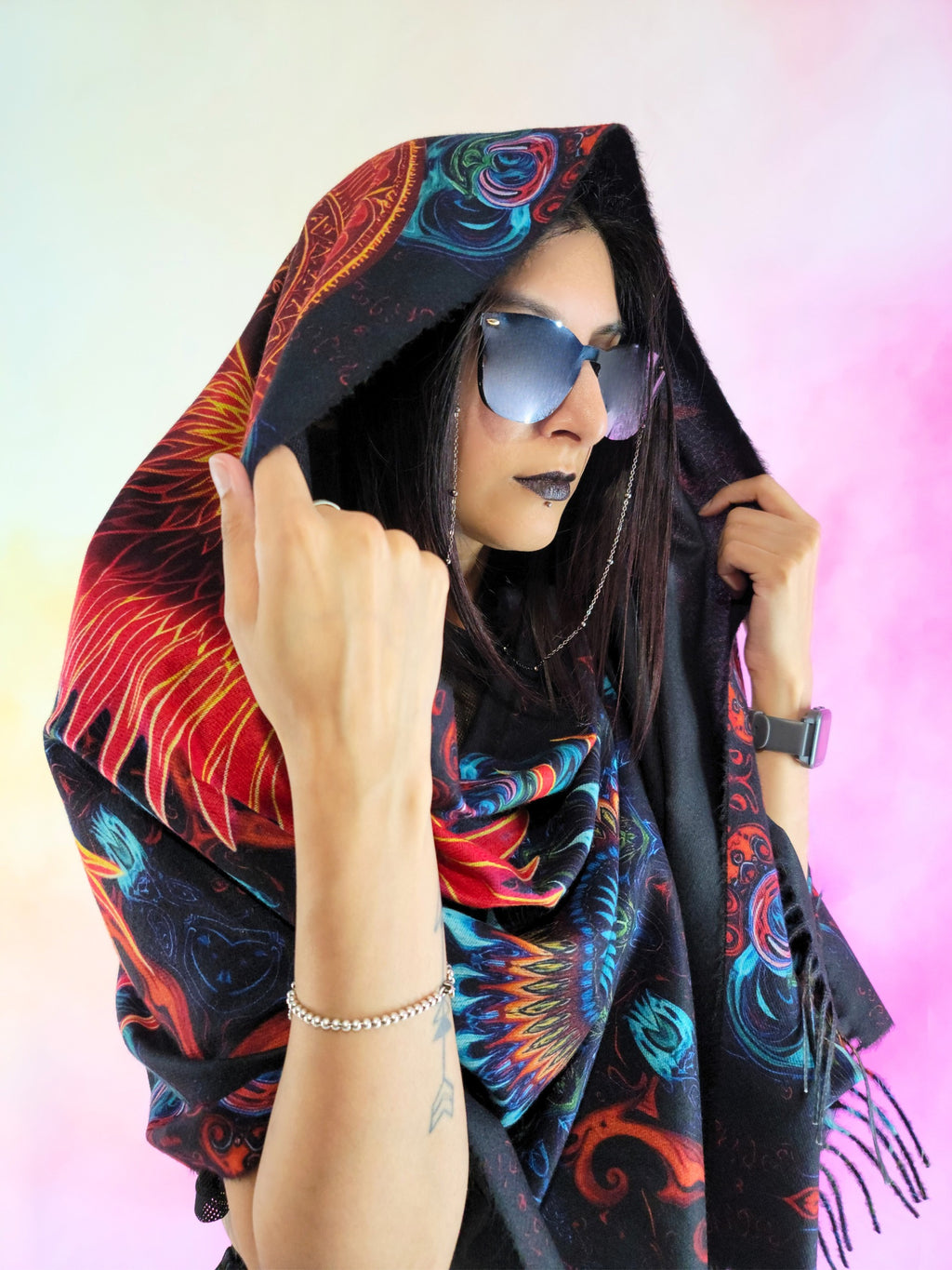 Pashmina with Phoenix Ignited design worn over the head and covering body and viewed from the front