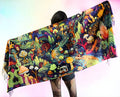 Shroomiverse festival pashmina worn from behind showing psychedelic mushroom universe artwork and colorful fantasy playmat design